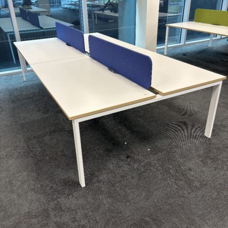 White Bank Of 4 Bank Desking With Blue Screens